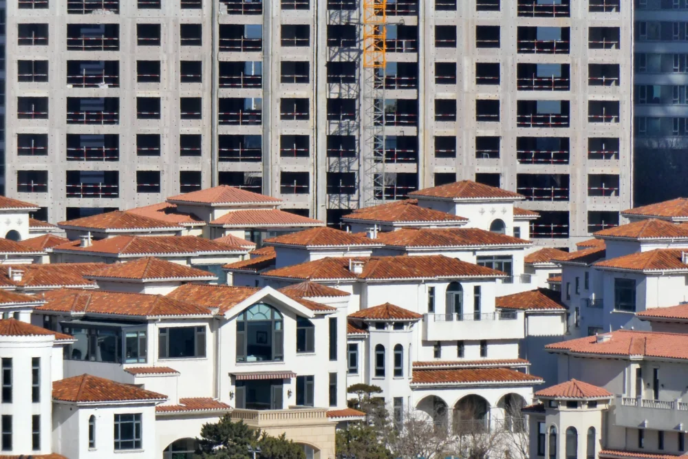 Beijing Signals Strategic Pivot in Real Estate Crisis as Economic Pressures Mount Ahead of National Congress.